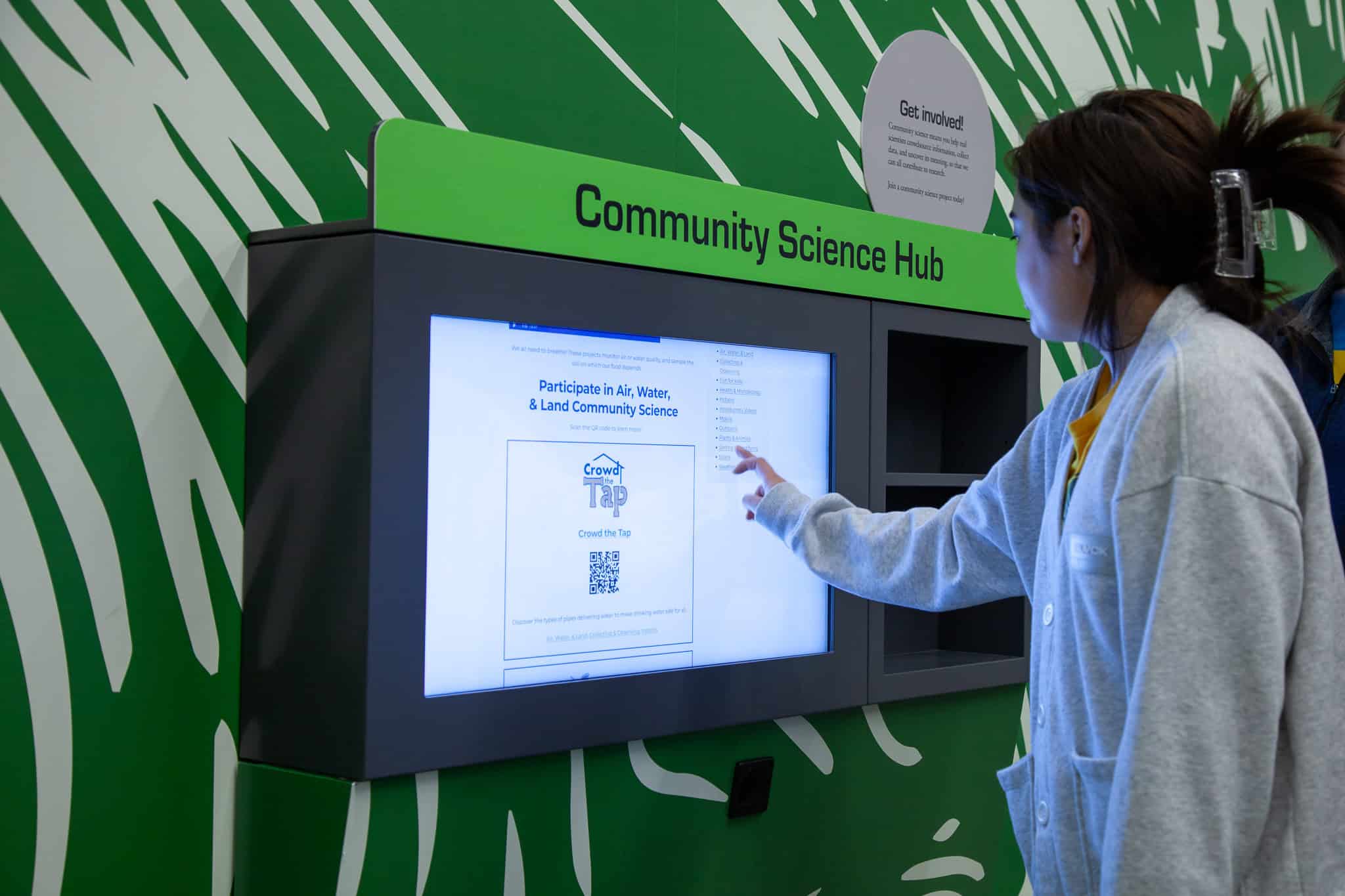 The Community Science Hub is an interactive screen visitors can use to bring science home.